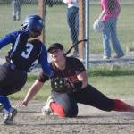 Palmers Lizzy McQuillin gets into third base safely in front of Kenai Centrals Kailey Stynsberg on Friday, May 23, 2025, at Steve Shearer Memorial Ball Park in Kenai, Alaska. (Photo by Jeff Helminiak/Peninsula Clarion)