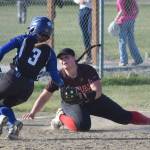 Palmer's Lizzy McQuillin gets into third base safely in front of Kenai Central's Kailey Stynsberg on Friday, May 23, 2025, at Steve Shearer Memorial Ball Park in Kenai, Alaska. (Photo by Jeff Helminiak/Peninsula Clarion)