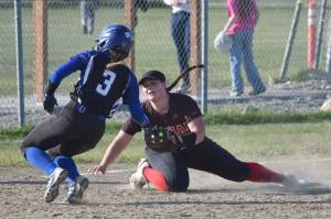 Palmer's Lizzy McQuillin gets into third base safely in front of Kenai Central's Kailey Stynsberg on Friday, May 23, 2025, at Steve Shearer Memorial Ball Park in Kenai, Alaska. (Photo by Jeff Helminiak/Peninsula Clarion)