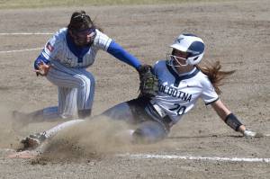 Soldotna's Aliya Blough gets back to first ahead of the tag of Palmer's Rylei Doyle on Saturday, May 24, 2025, at the Soldotna Little League fields in Soldotna, Alaska. (Photo by Jeff Helminiak/Peninsula Clarion)