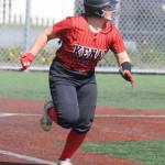 Kenaiճ Kailey Stynsberg runs to first base during a consolation game of the Northern Lights Conference tournament Friday, May 30, at Baranof Field in Kodiak, Alaska. (DEREK CLARKSTON/Kodiak Daily Mirror)
