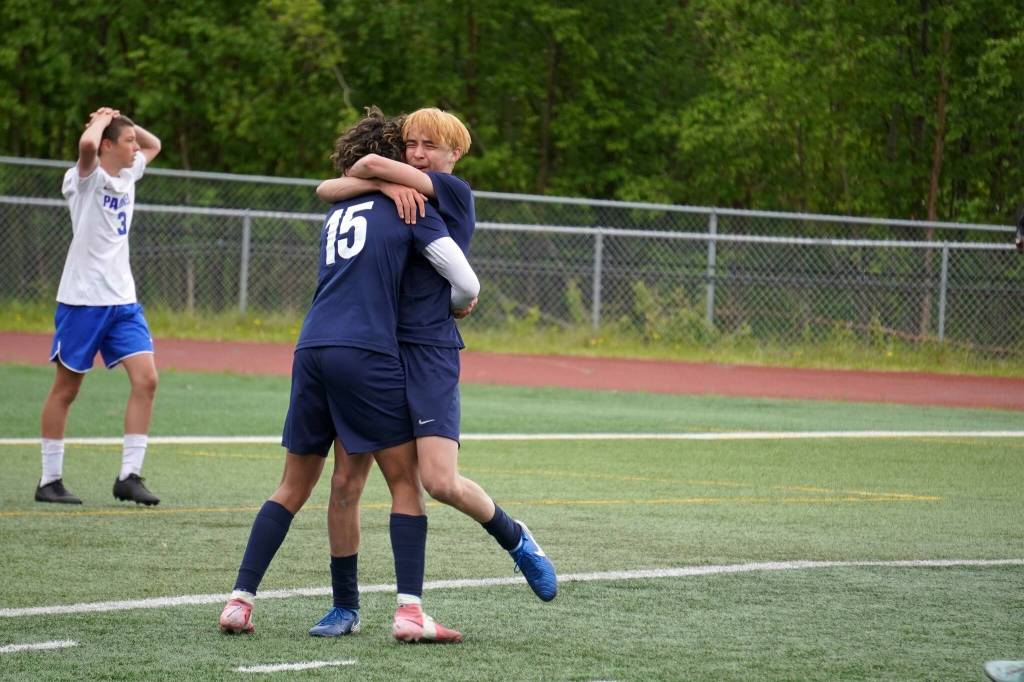 Soldotnas Harold Rudstrom and Lane Hillyer embrace after Hillyer scored a goal during the final match of the ASAA Division II Boys Soccer Championship at Wasilla High School in Wasilla, Alaska, on Saturday, May 31, 2025. (Jake Dye/Peninsula Clarion)