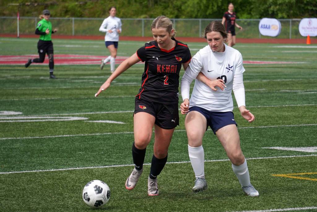 Kenais Brynnen Hanson and Soldotnas Anika Jedlicka battle for the ball during the final match of the ASAA Division II Girls Soccer Championship at Wasilla High School in Wasilla, Alaska, on Saturday, May 31, 2025. (Jake Dye/Peninsula Clarion)