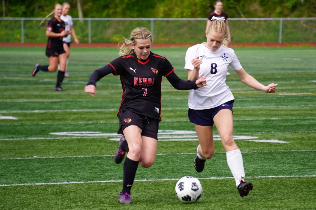 Kenais Tait Cooper and Soldotnas Keely Sundberg battle for the ball during the final match of the ASAA Division II Girls Soccer Championship at Wasilla High School in Wasilla, Alaska, on Saturday, May 31, 2025. (Jake Dye/Peninsula Clarion)