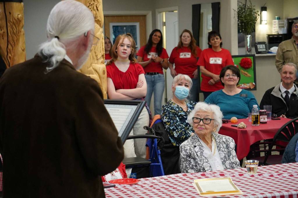 Soldotna Mayor Paul Whitney presents a commendation to Hanna Stormo during her 102nd birthday party at Aspen Creek Senior Living in Soldotna, Alaska, on Friday, May 30, 2025. (Jake Dye/Peninsula Clarion)