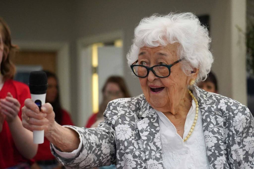 Hanna Stormo speaks during her 102nd birthday party at Aspen Creek Senior Living in Soldotna, Alaska, on Friday, May 30, 2025. (Jake Dye/Peninsula Clarion)