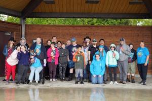 The Central Kenai Peninsula Special Olympics team stand for a photo at Soldotna Creek Park in Soldotna, Alaska, on Thursday, May 29, 2025. (Jake Dye/Peninsula Clarion)