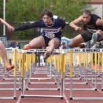 Soldotnas Wyatt Faircloth finishes second while resetting his school record in the 110-meter hurdles Saturday, May 31, 2025, at the Division I state track meet at Dimond High School in Anchorage, Alaska. Bartletts Tyler Drake won, while Souths Isaiah Douyon was third. The three demonstrate how tight the quarters can be on the narrower lanes of Dimonds track. (Photo by Jeff Helminiak/Peninsula Clarion)