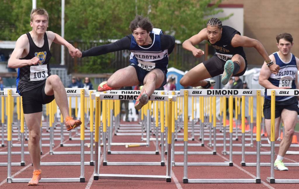 Soldotnas Wyatt Faircloth finishes second while resetting his school record in the 110-meter hurdles Saturday, May 31, 2025, at the Division I state track meet at Dimond High School in Anchorage, Alaska. Bartletts Tyler Drake won, while Souths Isaiah Douyon was third. The three demonstrate how tight the quarters can be on the narrower lanes of Dimonds track. (Photo by Jeff Helminiak/Peninsula Clarion)