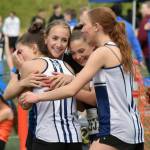 Soldotnas Annie Burns, Katie DeBardelaben, Kate Cox and Sasha Brott celebrate winning the 3,200-meter relay Saturday, May 31, 2025, at the Division I state track meet at Dimond High School in Anchorage, Alaska. (Photo by Jeff Helminiak/Peninsula Clarion)