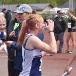 Soldotnas Shiloh Zichko, Sophia Jedlicki, Lucy Uhlir and Sarah Brown celebrate a state title and school record in the 800-meter relay with assistant coach Krista Arthur on Saturday, May 31, 2025, at the Division I state track meet at Dimond High School in Anchorage, Alaska. (Photo by Jeff Helminiak/Peninsula Clarion)