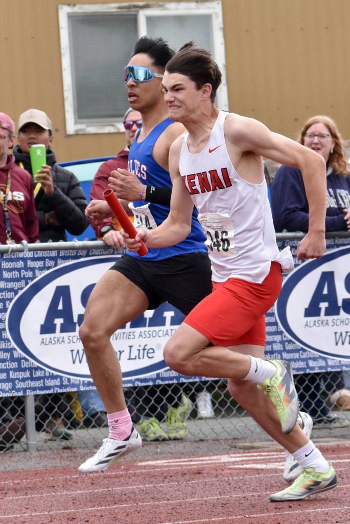 Kenai Centrals Gage Ivy races the 400-meter relay Saturday, May 31, 2025, at the Division II state track meet at Dimond High School in Anchorage, Alaska. Ivy won the triple jump at the meet. (Photo by Jeff Helminiak/Peninsula Clarion)