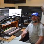 John Krohn, general manager at KBBI AM 890, prepares to go on the air on Friday, May 30, 2025, in the Gary Thomas Studio at the KBBI station in Homer, Alaska. (Delcenia Cosman/Homer News)