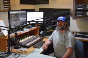John Krohn, general manager at KBBI AM 890, prepares to go on the air on Friday, May 30, 2025, in the Gary Thomas Studio at the KBBI station in Homer, Alaska. (Delcenia Cosman/Homer News)