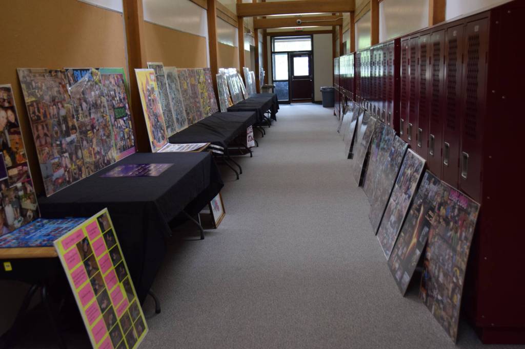 A hallway of Nikolaevsk School is filled with posterboards featuring photographs from different school years on Sunday, June 1. (Chloe Pleznac/Homer News)