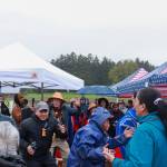 People dance in celebration of the Fishermans Honor Totem Pole in Hoonah on Friday, May 30, 2025. (Jasz Garrett / Juneau Empire)