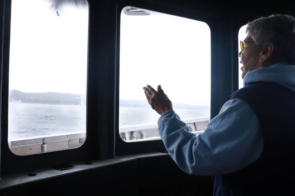 Wanda Culp dances on the catamaran heading to Hoonah on Friday, May 30, 2025. (Jasz Garrett / Juneau Empire)