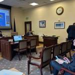 Juneau School District Superintendent Frank Hauser watches Deena Bishop, commissioner of the Alaska Department of Education and Early Development, discuss the federal disparity test for education funding provided by states during a Senate Education Committee meeting Wednesday, May 14, 2025. (Mark Sabbatini / Juneau Empire file photo)