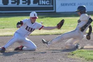 Homer's Austin Briscoe steals second base in front of Kenai Central's Everett Chamberlain at the Division II state baseball tournament Thursday, June 6, 2025, at Coral Seymour Memorial Park in Kenai, Alaska. (Photo by Jeff Helminiak/Peninsula Clarion)