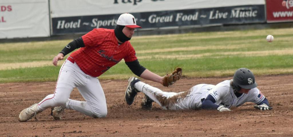 Soldotnas Matthew Schilling steals a base in front of Kenai Centrals Gabe Joanis at the Division II state baseball tournament at Coral Seymour Memorial Park in Kenai, Alaska, on Saturday, June 7, 2025. (Photo by Jeff Helminiak/Peninsula Clarion)