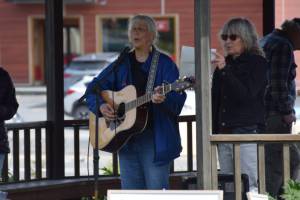 Cindy McKenna performs her song “It’s My Flag Too," on Friday, June 6, 2025 at WKFL Park in Homer, Alaska. (Chloe Pleznac/Homer News)