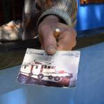 Larry Bernbeck holds out a photo he took in 1985 that inspired the building of Tugster on Thursday, June 5, 2025 in Homer, Alaska. (Chloe Pleznac/Homer News)