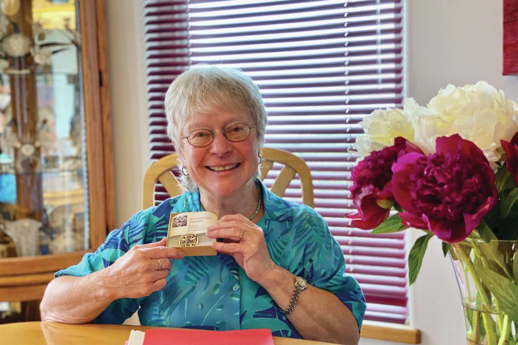 Woman of Wisdom Roberta Highland holds her award from South Peninsula Haven House in this photo taken July 25, 2020, in Homer, Alaska. (Photo courtesy South Peninsula Haven House)