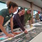 Leads for the Sterling Safety Corridor Improvements Project field questions and showcase their preferred design during an open house meeting at the Soldotna Regional Sports Complex in Soldotna, Alaska, on Tuesday, June 10, 2025. (Jake Dye/Peninsula Clarion)