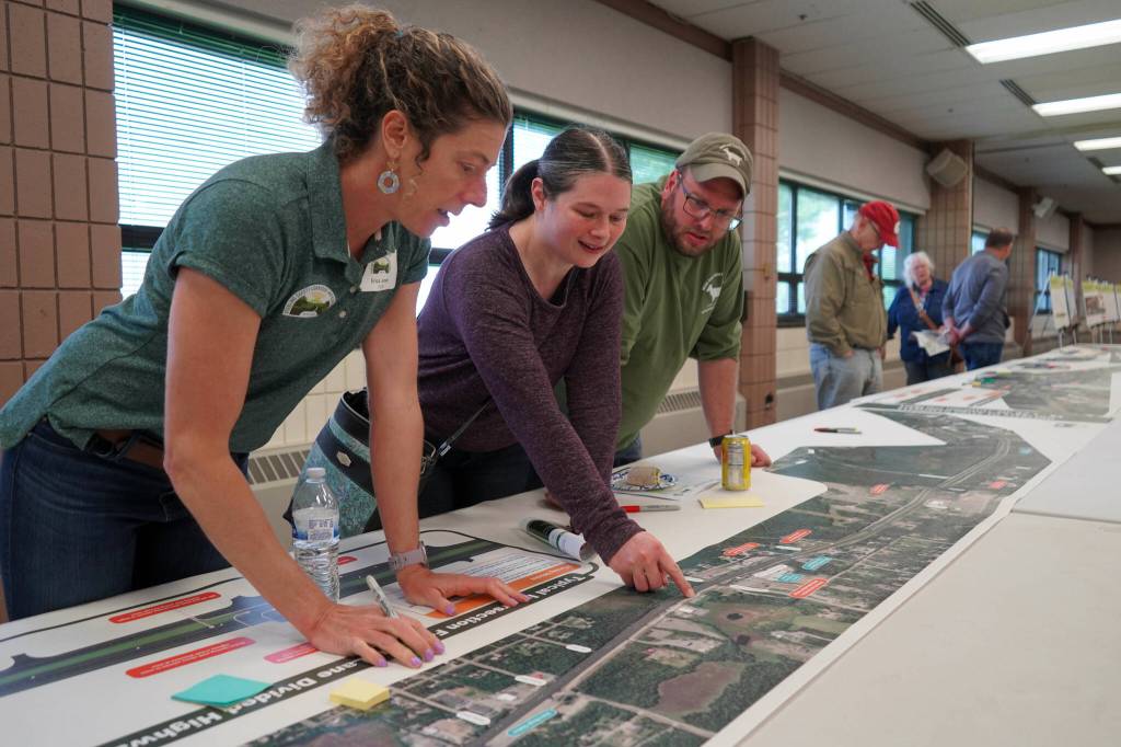 Leads for the Sterling Safety Corridor Improvements Project field questions and showcase their preferred design during an open house meeting at the Soldotna Regional Sports Complex in Soldotna, Alaska, on Tuesday, June 10, 2025. (Jake Dye/Peninsula Clarion)