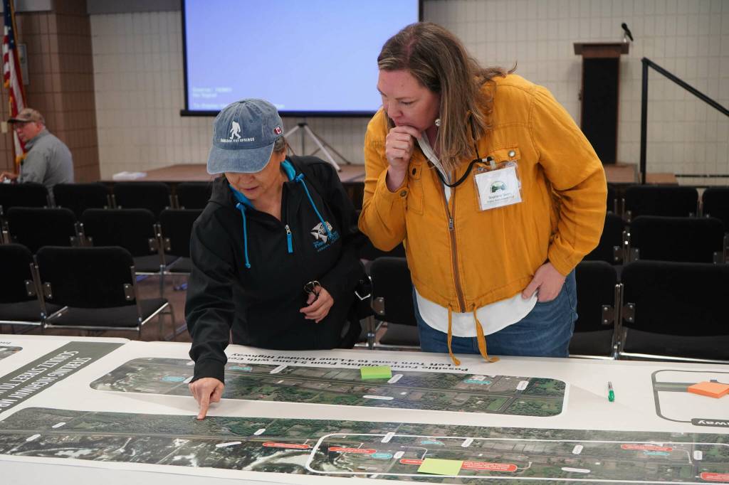 Leads for the Sterling Safety Corridor Improvements Project field questions and showcase their preferred design during an open house meeting at the Soldotna Regional Sports Complex in Soldotna, Alaska, on Tuesday, June 10, 2025. (Jake Dye/Peninsula Clarion)