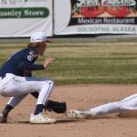 Wests Owen Tierney slides past the tag of Post 20 shortstop Jett Brophy on Friday, June 13, 2025, at Coral Seymour Memorial Park in Kenai, Alaska. (Photo by Jeff Helminiak/Peninsula Clarion)