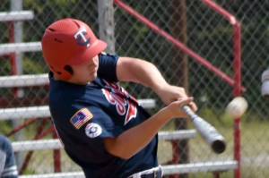 Post 20's Jayden Stuyvesant flies out to left field against West on Friday, June 13, 2025, at Coral Seymour Memorial Park in Kenai, Alaska. (Photo by Jeff Helminiak/Peninsula Clarion)