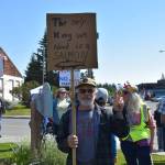 A demonstrator holds up a sign during the No Kings protest on Saturday, June 14, 2025, at WKFL Park in Homer, Alaska. (Chloe Pleznac/Homer News)