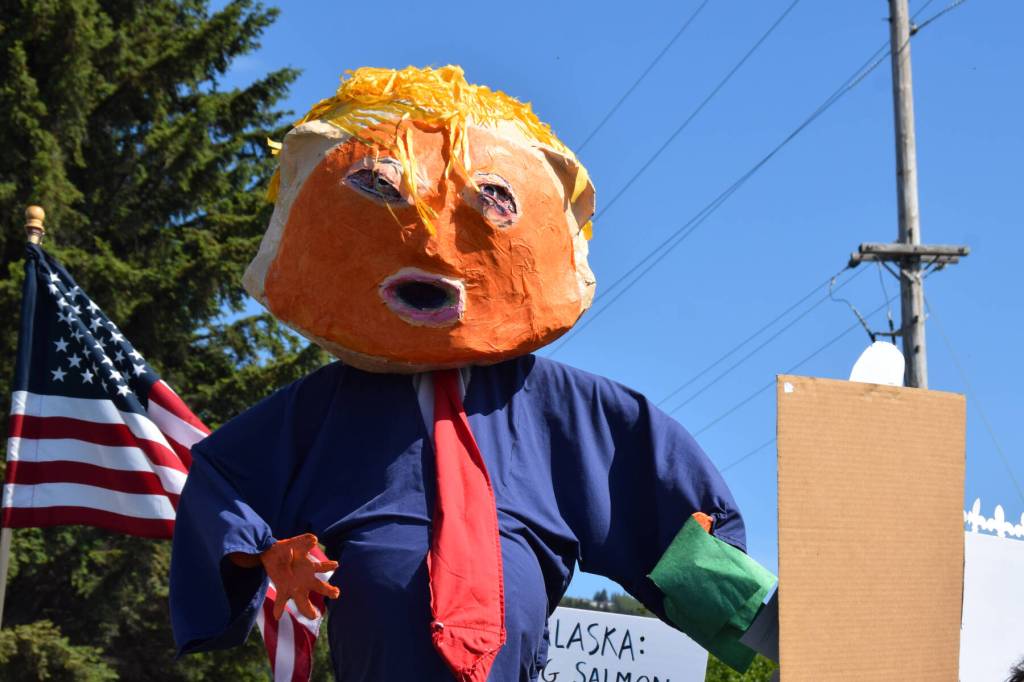A Trump puppet by local artist Charles Aguilar floats above the crowd during the No Kings protest at WKFL Park on Saturday, June 14, 2025, in Homer, Alaska. (Chloe Pleznac/Homer News)