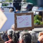 A demonstrator holds up a sign during the No Kings protest on Saturday, June 14, 2025, at WKFL Park in Homer, Alaska. (Chloe Pleznac/Homer News)