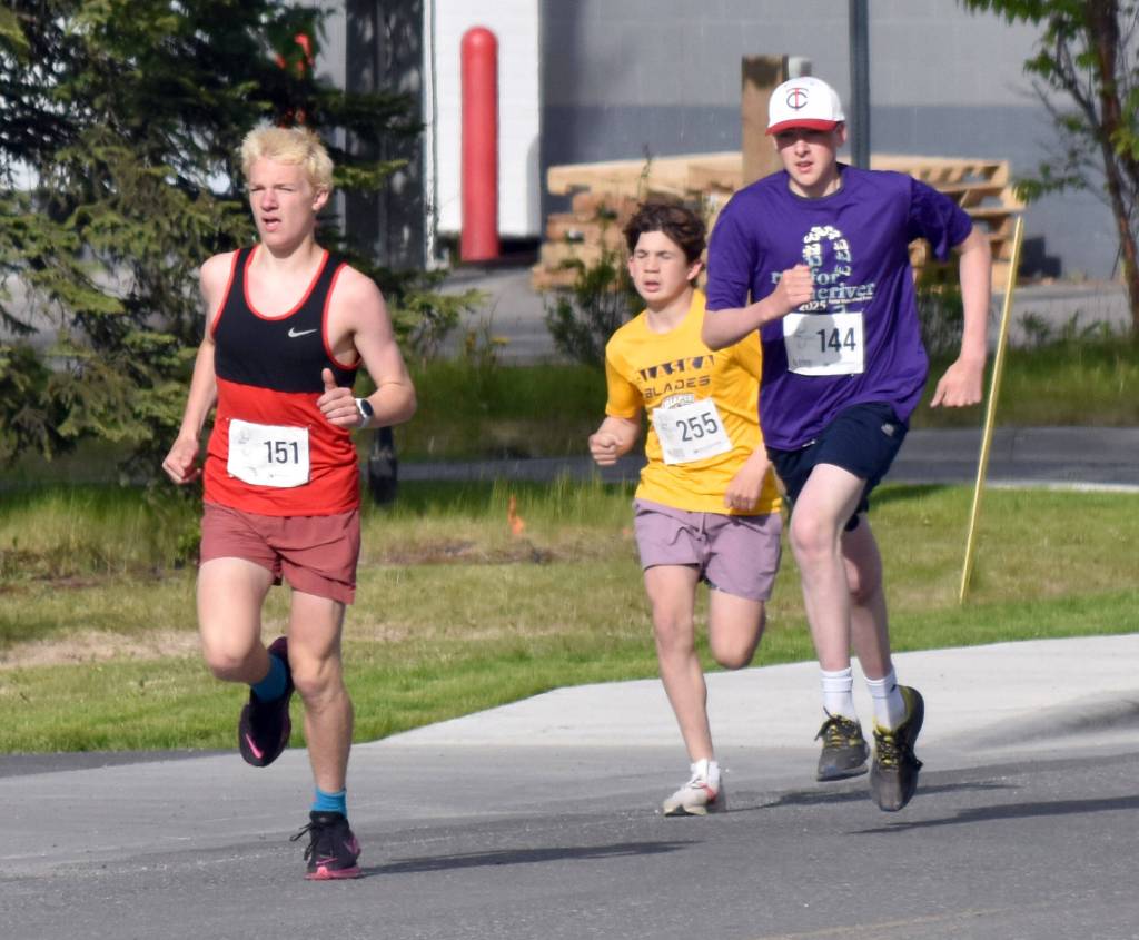 Mens 5-kilometer champion Ollie Dahl leads Dwight Brown and Paul Wertanen at the Run for the River on Saturday, June 14, 2025, in Soldotna, Alaska. (Photo by Jeff Helminiak/Peninsula Clarion)