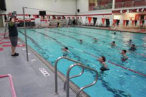 Jake Dye/Peninsula Clarion
Pool manager and swim coach Will Hubler leads a treading water exercise at Kenai Central High School on Tuesday.