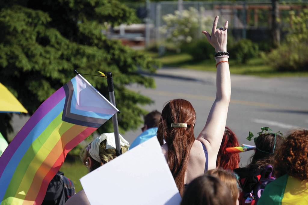 A Pride march moves along the Sterling Highway through Soldotna on Saturday, June 14.