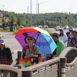 A pride march moves along the Sterling Highway through Soldotna, Alaska, on Saturday, June 14, 2025. (Jake Dye/Peninsula Clarion)