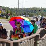 A Pride march moves along the Sterling Highway through Soldotna, Alaska, on Saturday, June 24, 2025. (Jake Dye/Peninsula Clarion)