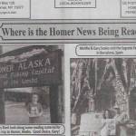 The Homer News, a small print publication based in Cortland County, New York, features photos on the back page of readers who travel with copies of the newspaper. This issue of The Homer News shows Gary Root visiting Homer, Alaska and posing for a photo with the New York paper under the "Homer Alaska, Halibut Fishing Capital of the World" sign at the top of Baycrest Hill. Photo courtesy of Kim L. Hubbard