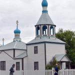Austin Bradford of Kenai and Anna Berington of Knik run past the Holy Assumption of the Virgin Mary Orthodox Church during the Kenai Summer Solstice Fun Run in Kenai, Alaska, on Saturday, June 21, 2025. (Photo by Jeff Helminiak/Peninsula Clarion)
