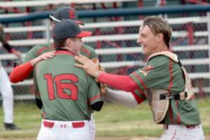 Pitcher Jax Lee is congratulated by catcher Conner Mitchuson after Madisonville (Kentucky) Post 6 won the championship game of the Lance Coz Wood Bat Tournament on Sunday, June 22, 2025, at Coral Seymour Memorial Park in Kenai, Alaska. (Photo by Jeff Helminiak/Peninsula Clarion)