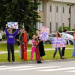 Swimmers and parents protest the proposed closure of Kenai Peninsula Borough School District pools outside of the Kenai Peninsula Borough Administration Building in Soldotna, Alaska, on Thursday, June 26, 2025. (Jake Dye/Peninsula Clarion)
