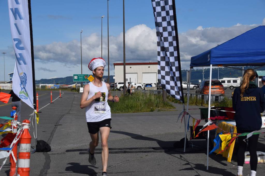 Seamus McDonough crosses the finish line near Lands End Resort, taking first place in the mens category for the Homer Spit Run 10K to the Bay on Saturday, June 28, 2025, in Homer, Alaska. (Delcenia Cosman/Homer News)