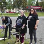 Demonstrators gather at the Blazy Mall, outside the offices of U.S. Sens. Lisa Murkowski and Dan Sullivan, to protest proposed Medicaid cuts on Thursday, June 26 in Soldotna. The cuts were included in legislation passed by the U.S. Senate early Tuesday morning. (Photo by Jonas Oyoumick/Peninsula Clarion)