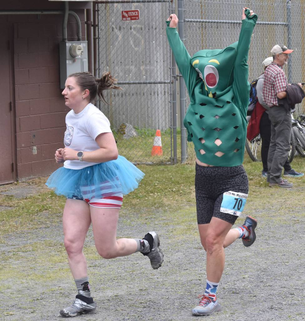 Allison Barnwell, 33, of Wenatchee, Washington, carries on the tradition of the Gumby costume during the womens race at the Mount Marathon Race on July 4, 2025, in Seward, Alaska. (Photo by Jeff Helminiak/Peninsula Clarion)