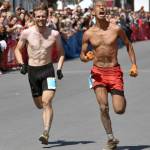 Jessie McAuley, 25, of British Columbia and Bodhi Gross, 24, of South Lake Tahoe, California, sprint to the finish of the mens race at the Mount Marathon Race on July 4, 2025, in Seward, Alaska. (Photo by Jeff Helminiak/Peninsula Clarion)