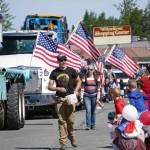 Children leap forward to grab candy during a Fourth of July parade on South Willow Street in Kenai, Alaska, on July 4, 2025. (Photo courtesy Sarah Every)