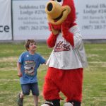 Connor Perry plays with Scoop at the Oilers All-Star Family Field Day on Saturday, July 5, 2025, at Coral Seymour Memorial Park in Kenai, Alaska. (Photo by Jeff Helminiak/Peninsula Clarion)